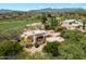 Aerial view of a luxury home with golf course, gorgeous mountain views, and mature landscaping at 3120 Arroyo Hondo --, Carefree, AZ 85377