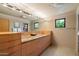 Bathroom with dual sinks, granite counters, and light wood cabinets at 3120 Arroyo Hondo --, Carefree, AZ 85377