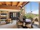 Elegant dining room with a modern chandelier and large windows offering picturesque desert views at 3120 Arroyo Hondo --, Carefree, AZ 85377
