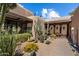 Beautiful Southwestern home exterior showcasing desert landscaping and unique architectural details at 3120 Arroyo Hondo --, Carefree, AZ 85377