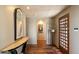 Elegant foyer with wood flooring, a stylish console table, and a decorative front door at 3120 Arroyo Hondo --, Carefree, AZ 85377