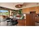 Modern kitchen featuring a curved island with seating and views of the outdoor patio at 3120 Arroyo Hondo --, Carefree, AZ 85377