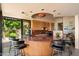Stylish kitchen boasts a large island, modern appliances, and sliding glass doors to the outdoor patio at 3120 Arroyo Hondo --, Carefree, AZ 85377