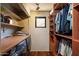 Convenient laundry room with built-in storage, washer, and dryer, offering both functionality and style at 3120 Arroyo Hondo --, Carefree, AZ 85377