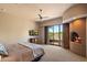 Comfortable main bedroom featuring a fireplace, scenic views, and carpeted floors at 3120 Arroyo Hondo --, Carefree, AZ 85377