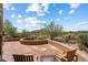 Outdoor patio with desert landscape views and comfortable lounging chairs at 3120 Arroyo Hondo --, Carefree, AZ 85377