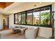 Cozy sitting area with views of the desert landscape and a unique decorative statue at 3120 Arroyo Hondo --, Carefree, AZ 85377