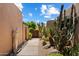 Inviting walkway to home with desert landscaping, rock features, and a wooden gate entrance at 3120 Arroyo Hondo --, Carefree, AZ 85377