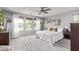Light-filled bedroom with a large window, neutral colors, and comfortable furnishings at 3272 E Orchid Ln, Gilbert, AZ 85296
