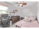 Comfortable bedroom features a ceiling fan and desk area for work or study at 3272 E Orchid Ln, Gilbert, AZ 85296