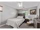 Cozy bedroom features a wooden headboard, soft lighting, and comfortable seating at 3272 E Orchid Ln, Gilbert, AZ 85296