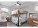 This bedroom features a practical bunk bed and a cozy study area at 3272 E Orchid Ln, Gilbert, AZ 85296