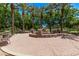 Beautiful community park featuring water feature, lush landscaping, seating, and mature palm trees at 3272 E Orchid Ln, Gilbert, AZ 85296