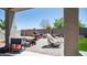 An outdoor patio area featuring a brick floor and an assortment of outdoor furniture at 33013 N Ash Tree Ln, San Tan Valley, AZ 85144
