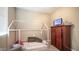 Bedroom featuring a childs bed frame, a television, and carpeted floors at 33013 N Ash Tree Ln, San Tan Valley, AZ 85144