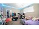 View of a bedroom with carpeted floors, an overhead light, and a window with blinds at 33013 N Ash Tree Ln, San Tan Valley, AZ 85144