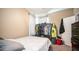 A bedroom with a full size bed, a window with natural light, and a closet with clothes at 33013 N Ash Tree Ln, San Tan Valley, AZ 85144