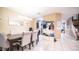 Open-concept dining area features stylish decor and leads to a hallway at 33013 N Ash Tree Ln, San Tan Valley, AZ 85144