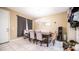 Cozy dining room with seating for four and modern light fixture at 33013 N Ash Tree Ln, San Tan Valley, AZ 85144