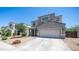 Two-story home features a desert landscape, concrete driveway, and a two-car garage at 33013 N Ash Tree Ln, San Tan Valley, AZ 85144