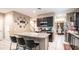 Open kitchen with granite countertops and stainless steel appliances at 33013 N Ash Tree Ln, San Tan Valley, AZ 85144