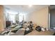 Large living room with lots of space, carpet floors, and neutral walls at 33013 N Ash Tree Ln, San Tan Valley, AZ 85144