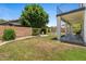 Large backyard featuring a well-maintained lawn, patio, mature trees, and privacy fence at 3784 E Washington Ct, Gilbert, AZ 85234
