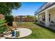 Charming backyard featuring a patio, pergola, lush lawn, and space for outdoor living and entertaining at 3784 E Washington Ct, Gilbert, AZ 85234