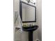 Elegant bathroom features a sleek black pedestal sink with decorative mirror and modern fixtures at 3784 E Washington Ct, Gilbert, AZ 85234