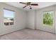 Bright bedroom boasting ample natural light from two exterior windows at 3784 E Washington Ct, Gilbert, AZ 85234