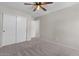 Bedroom with sliding closet doors and neutral carpet flooring throughout at 3784 E Washington Ct, Gilbert, AZ 85234