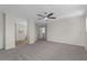 Spacious bonus room with plush carpet flooring, leading to other areas of the home at 3784 E Washington Ct, Gilbert, AZ 85234