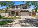 Charming two-story home featuring a well-manicured lawn, covered porch, and attached two-car garage at 3784 E Washington Ct, Gilbert, AZ 85234