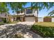 Inviting two-story home with a front porch, a two-car garage, and a lush green lawn at 3784 E Washington Ct, Gilbert, AZ 85234