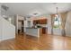 Open kitchen floor plan featuring an island, stainless appliances, and hardwood floors at 3784 E Washington Ct, Gilbert, AZ 85234
