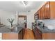 Open concept kitchen features stainless steel appliances, tile backsplash, and an island at 3784 E Washington Ct, Gilbert, AZ 85234