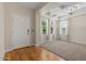 Bright living room featuring hardwood floors, coffered ceilings, and natural light at 3784 E Washington Ct, Gilbert, AZ 85234