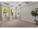 Bright living room with coffered ceilings, neutral carpet, and three large windows with bright natural light at 3784 E Washington Ct, Gilbert, AZ 85234
