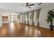 Open-concept living space with wood flooring and access to the kitchen and backyard at 3784 E Washington Ct, Gilbert, AZ 85234
