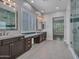 Bathroom featuring dual vanities, modern fixtures, and tile floors at 3809 E Lynx Pl, Chandler, AZ 85249