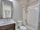 This bathroom features a shower and tub combo, updated sink, and tile backsplash at 3809 E Lynx Pl, Chandler, AZ 85249