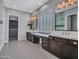 Bathroom with dual vanities, large mirrors, and tiled floor, creating a functional space at 3809 E Lynx Pl, Chandler, AZ 85249