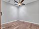 Simple bedroom showcases hardwood floors and a modern ceiling fan at 3809 E Lynx Pl, Chandler, AZ 85249