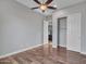 Bedroom with hardwood floors, closet space and view into the bathroom at 3809 E Lynx Pl, Chandler, AZ 85249