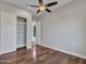 Bright bedroom features a ceiling fan, hardwood flooring and a closet with shelves at 3809 E Lynx Pl, Chandler, AZ 85249
