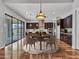 Open dining area features wood cabinets, a stylish round rug, and modern lighting fixtures at 3809 E Lynx Pl, Chandler, AZ 85249