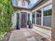 Close-up of home's entry courtyard with wrought iron door, plants and decorative rock ground cover at 3809 E Lynx Pl, Chandler, AZ 85249