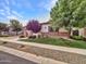 Lovely single-story home with manicured lawn, desert landscaping, and a welcoming facade at 3809 E Lynx Pl, Chandler, AZ 85249