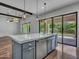 Open floor plan with island, stainless steel dishwasher, and natural light, perfect for entertaining and Gathering life at 3809 E Lynx Pl, Chandler, AZ 85249