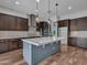 Modern kitchen with a large island, stainless steel appliances, and ample cabinet space at 3809 E Lynx Pl, Chandler, AZ 85249